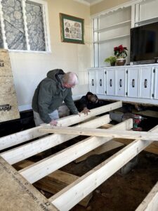 crew installing new floor joists over an open crawlspace during a structural repair in Elizabethtown NC
